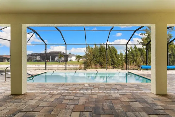 Outdoor pool featuring a patio, and a lanai