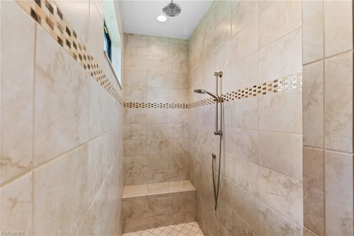 Walk-in shower with dual shower heads