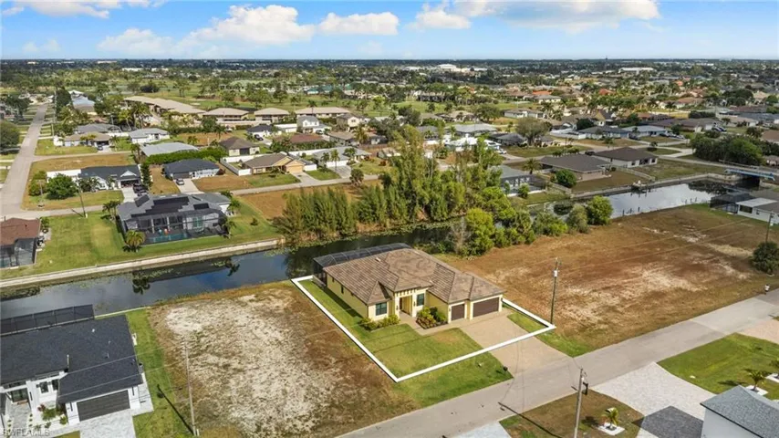Aerial view of residential area with a canal