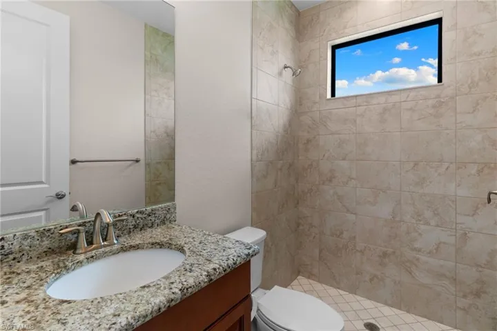 Guest Bathroom with vanity and a shower stall