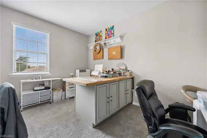 Office area featuring light colored carpet