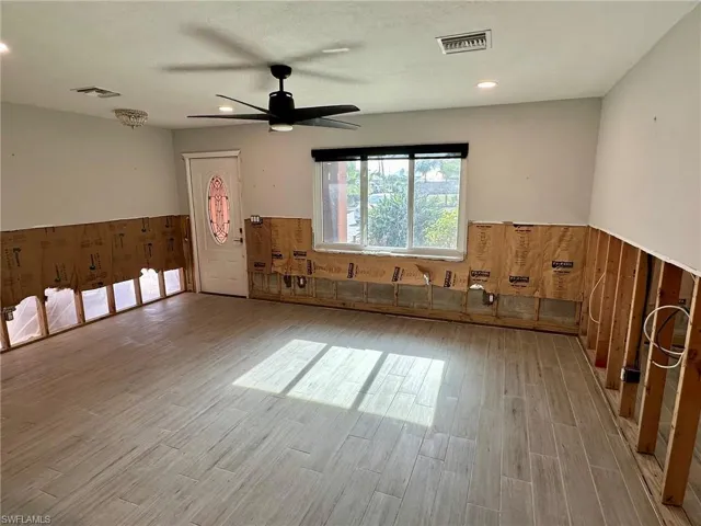 Unfurnished room featuring ceiling fan and light hardwood / wood-style floors