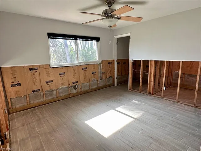 Spare room featuring ceiling fan and light hardwood / wood-style floors