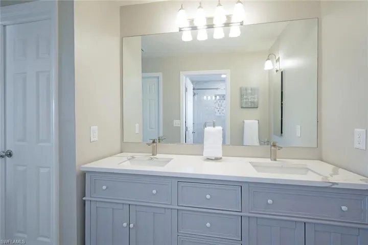The ensuite Master Bath with twin basins + walk in shower