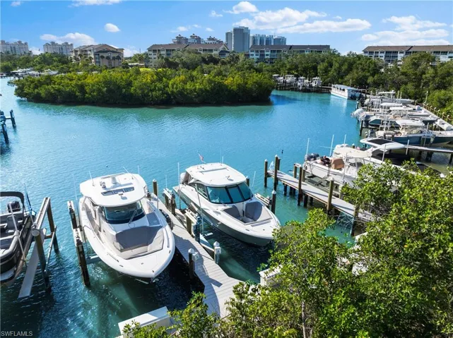 View of dock with a water view and boat lift