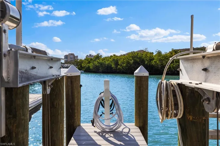 Dock area featuring a water view