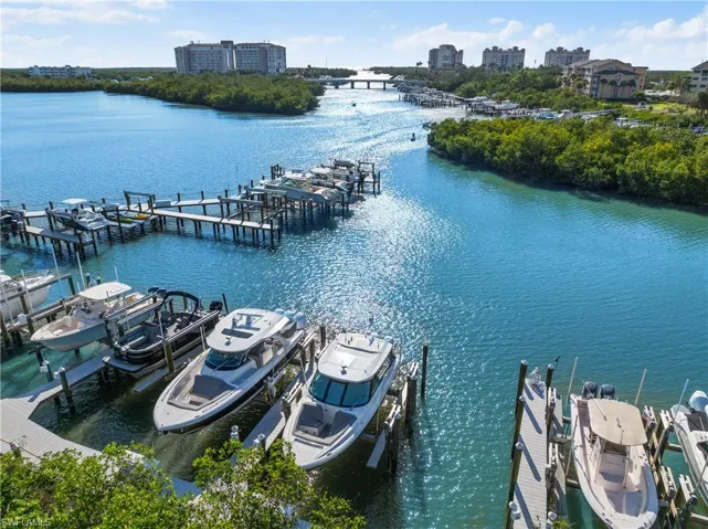View of dock with a water view and boat lift