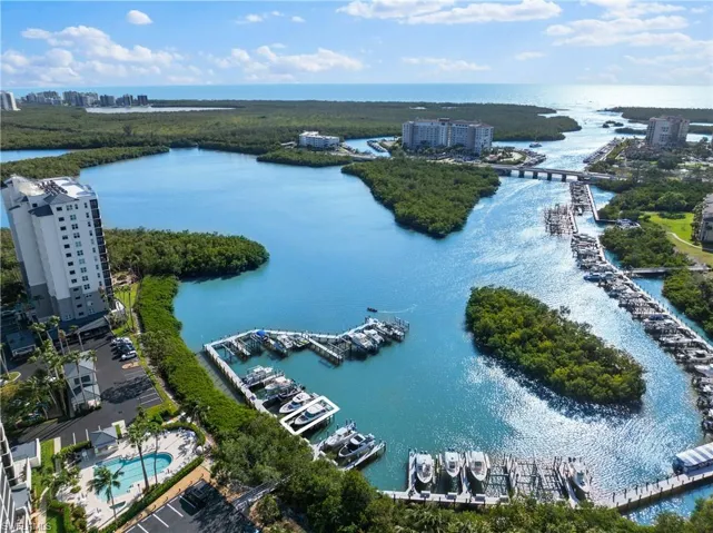 Aerial view featuring a water view and a view of city