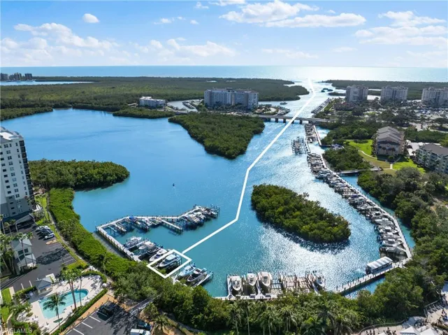 Birds eye view of property featuring a view of city and a water view