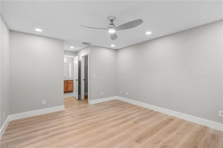Spare room with recessed lighting, light wood finished floors, and ceiling fan