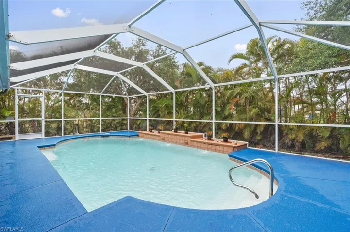 Swimming pool with a lanai and a sunroom