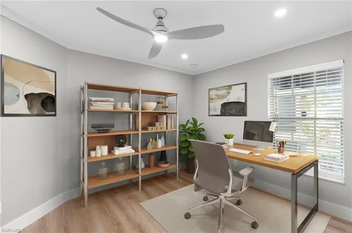 Office space featuring ornamental molding, light wood finished floors, a ceiling fan, and recessed lighting
