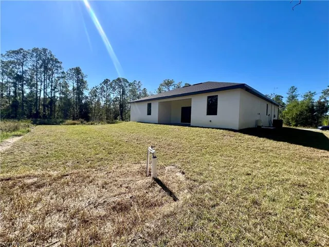View of backyard on a HALF ACRE LOT