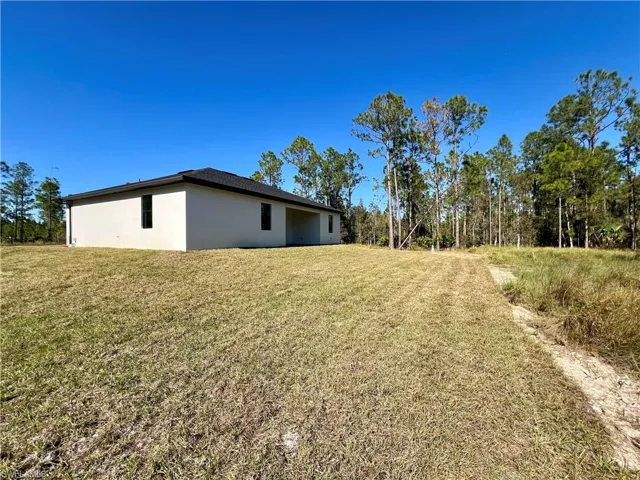 View of backyard on a HALF ACRE LOT