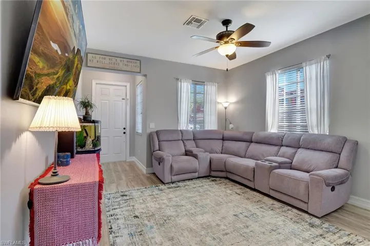 Living room featuring ceiling fan