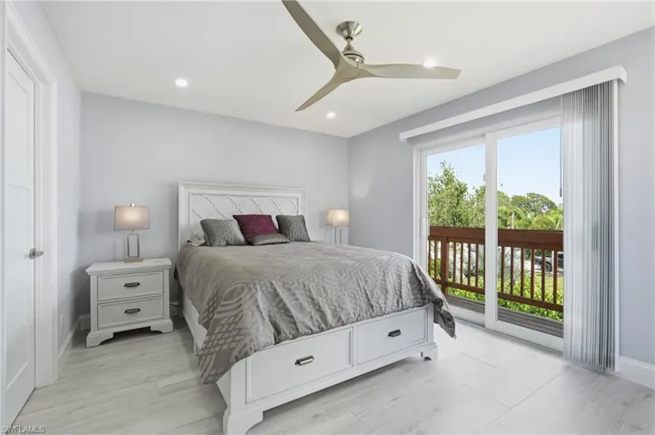 Bedroom featuring wood-finish flooring, recessed lighting, and a modern ceiling fan