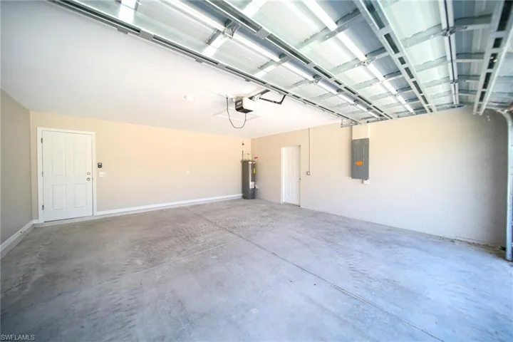 Oversized 2 Car Garage with a garage door opener and water heater!