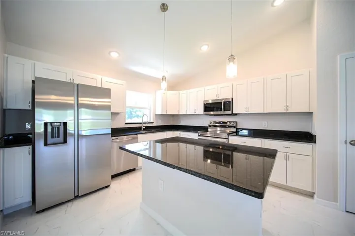 The Island Kitchen Comes With Black Granite Countertops And Backsplash, White Shaker Wooden Soft Close Cabinets And Drawers, Stainless Steel Appliances, Pendant Lighting, Stainless Steel Fixtures, And A Large Walk-In Pantry!