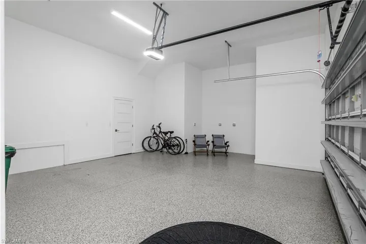 Oversized 2 Car Garage with a door opener. Check out the Epoxy flooring too!