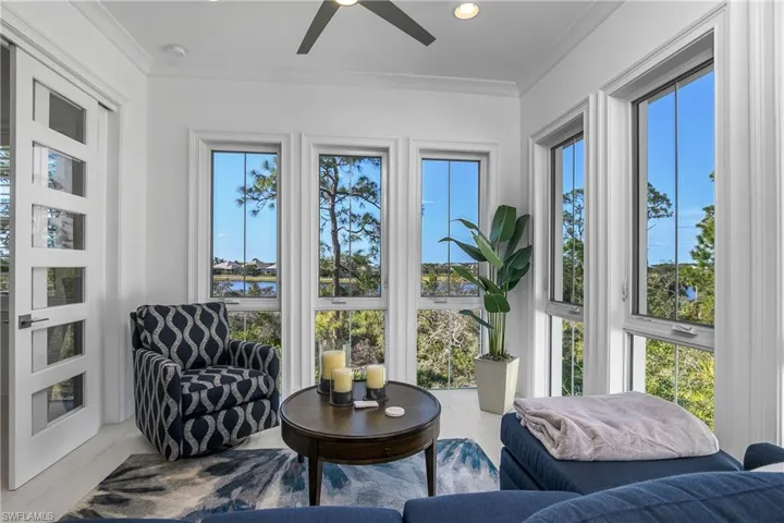 Sunroom / featuring ceiling fan and a healthy amount of sunlight. Views of the Cypress Waterway, the Natural Preserve and Sunsets from this room.