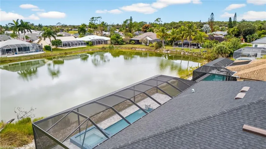 Aerial view of residential area with a nearby body of water