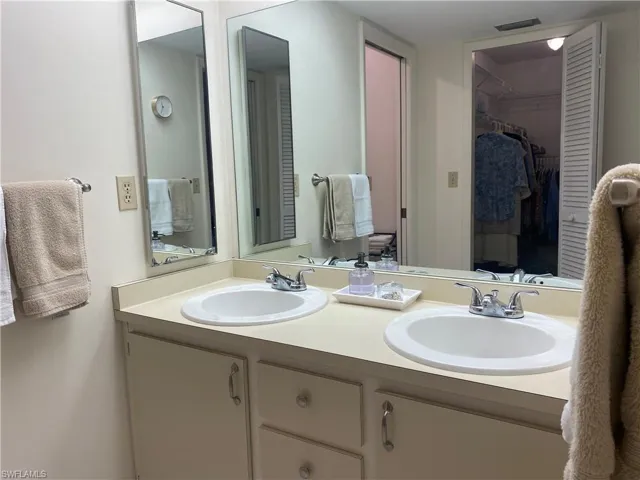 Bathroom with dual bowl vanity