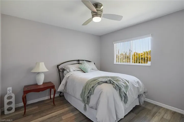 Bedroom featuring a ceiling fan and wood finished floors