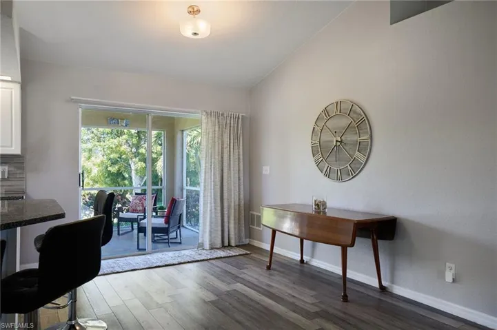 Office area with dark wood finished floors and baseboards