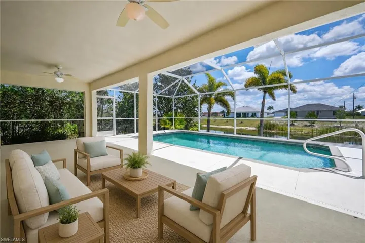 Screened lanai featuring a swimming pool, concrete patio, and direct access to outdoor living