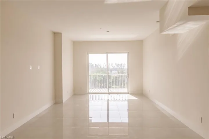 Living room with light tile floors