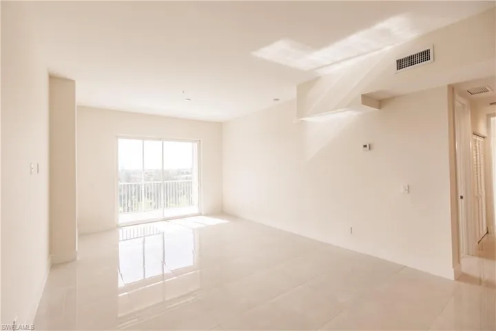Living room with light tile floors