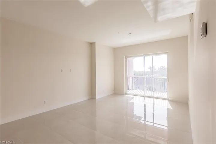 Living room featuring light tile floors