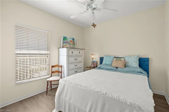 Bedroom featuring ceiling fan and light wood-type flooring