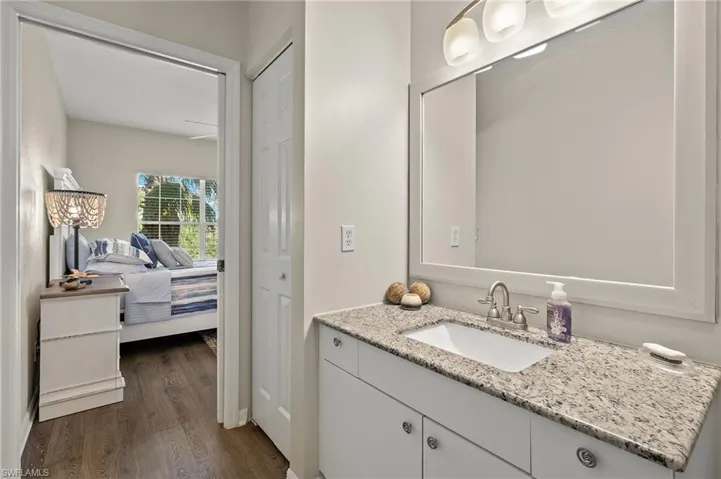 Bathroom with vanity and hardwood / wood-style flooring