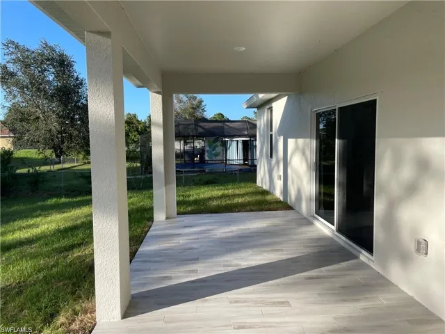 View of patio featuring a trampoline