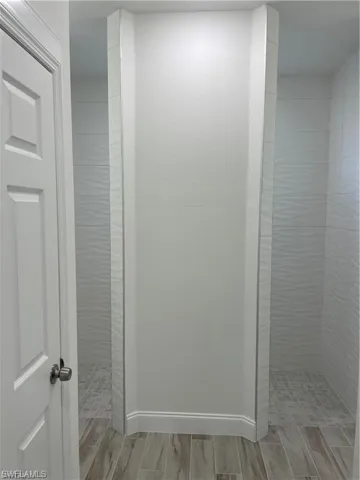 Bathroom featuring a tile shower