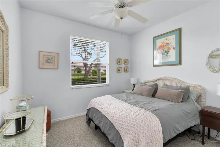 Bedroom with carpet flooring and ceiling fan