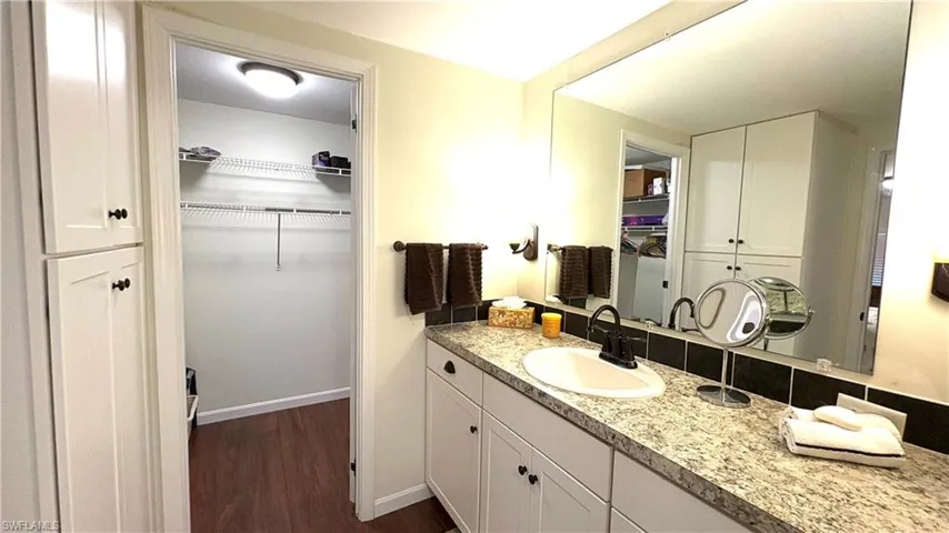 The Primary Bathroom has lots of storage space and an adjacent walk-in closet.