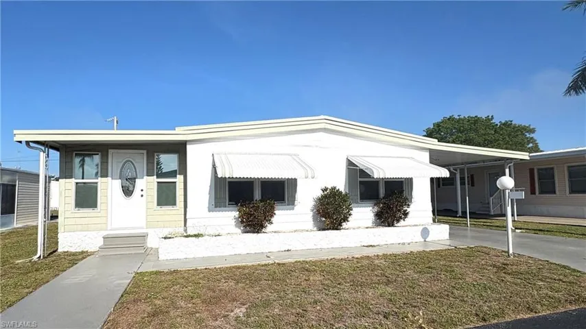 Welcome to lovely Lazy Days Village where you own your land AND this beautiful home!