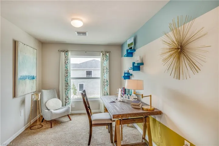 Office area featuring carpet flooring