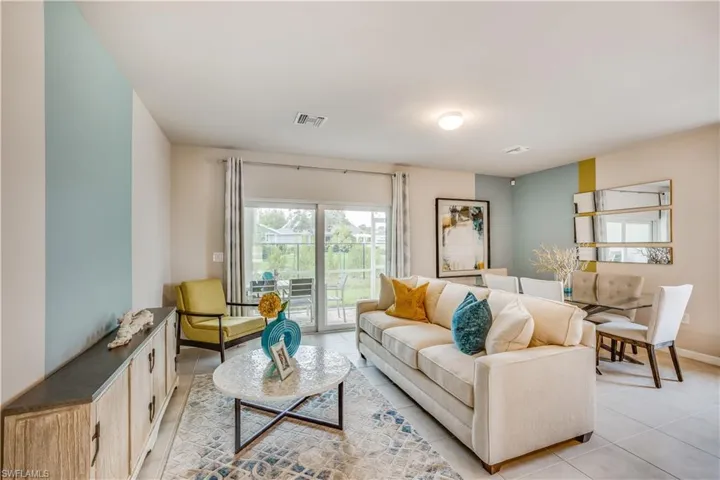Living room with light tile patterned flooring