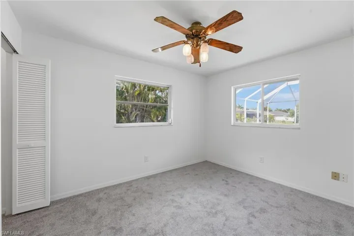 Room featuring neutral-toned carpeting and white painted walls