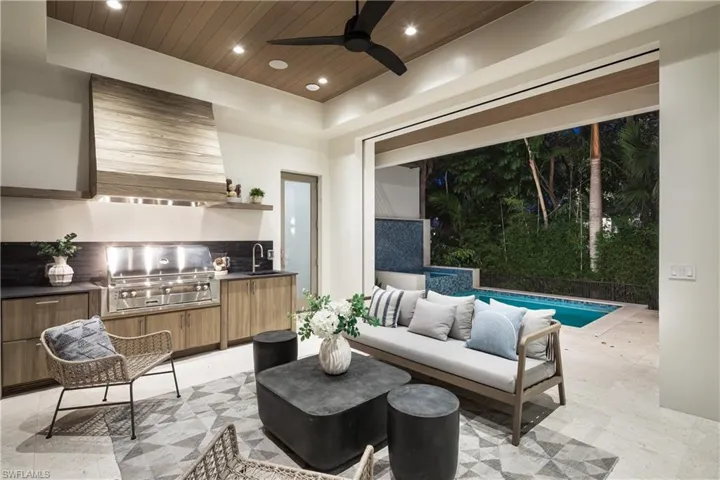 Living area featuring wood ceiling, a ceiling fan, and recessed lighting