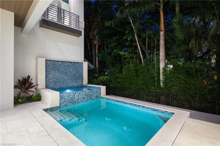 View of pool with a pool with connected hot tub