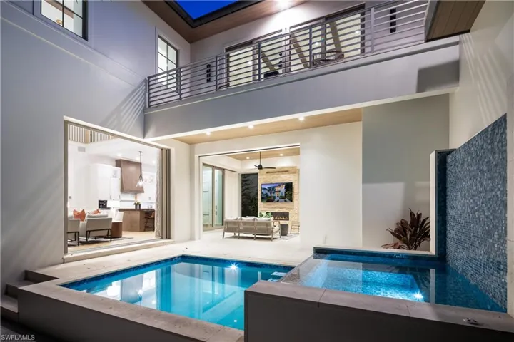 View of pool featuring a patio, an outdoor hangout area, ceiling fan, and a pool with connected hot tub