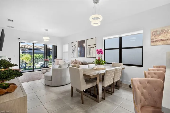 Dining space featuring light tile patterned floors