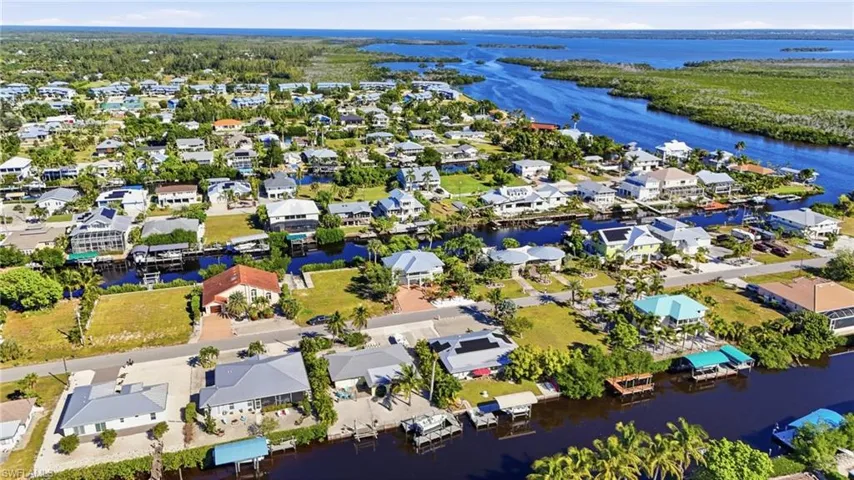 View of property location with nearby suburban area and a large body of water
