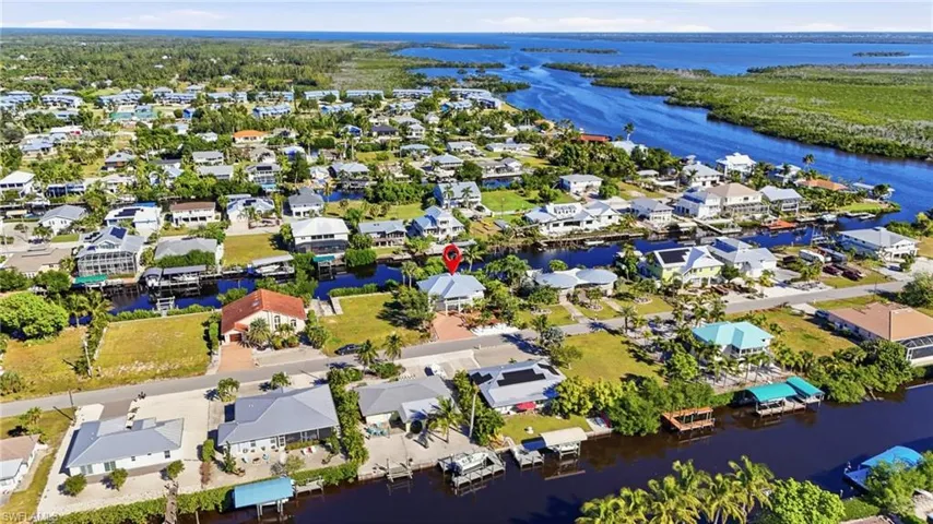 View of property location featuring nearby suburban area and a large body of water