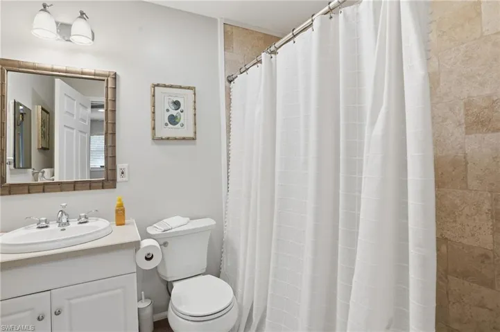 Full bathroom featuring vanity and a shower with curtain