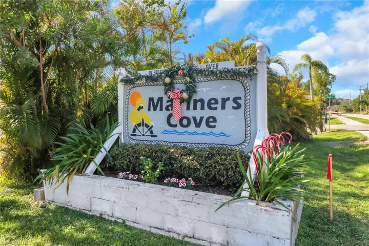 Community / neighborhood sign with a lawn